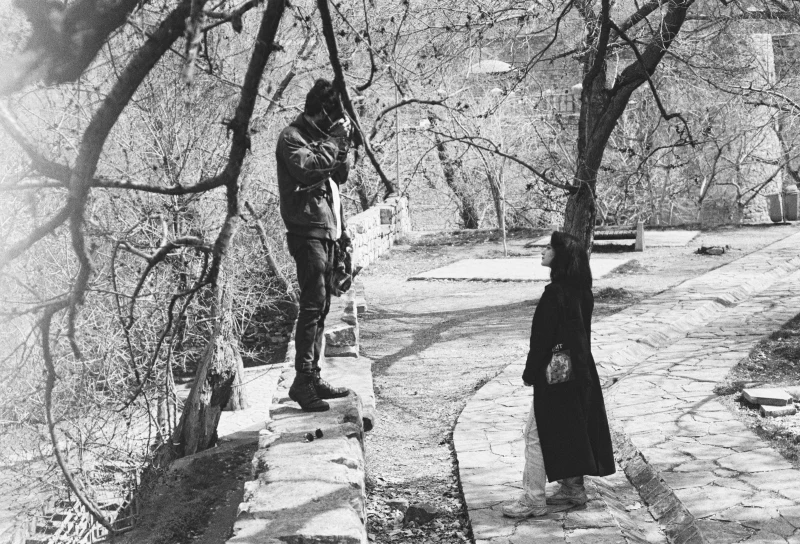 A man taking photo of a woman